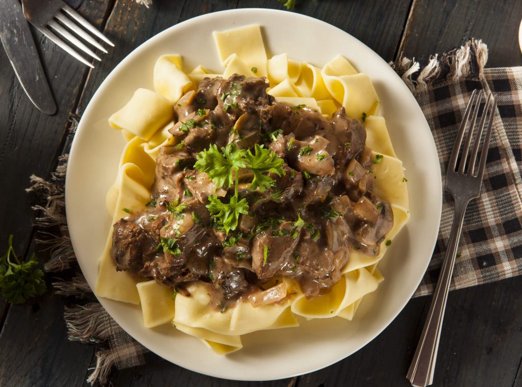 Instant Pot Beef Stroganoff on a plate with napkins