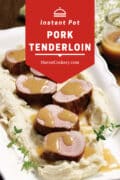 Instant Pot Pork Tenderloin on a bed or mashed potatoes with maple dijon gravy drizzled over the top.
