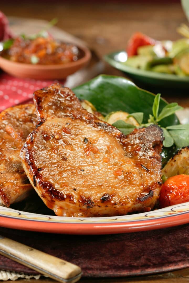 Pan Fried Pork Chops with nicely browned exterior ready to serve.